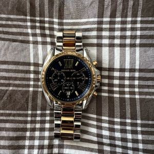 Michael Kors watch in silver, gold and blue face.